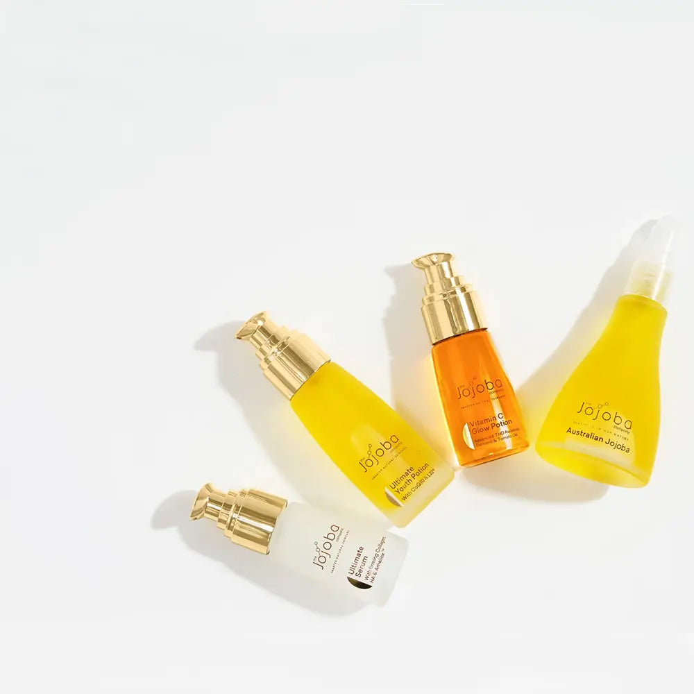 Collection of Jojoba oil bottles on a white background
